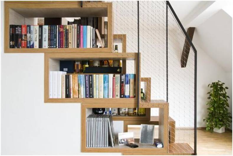 Compact bookshelves built into the staircase